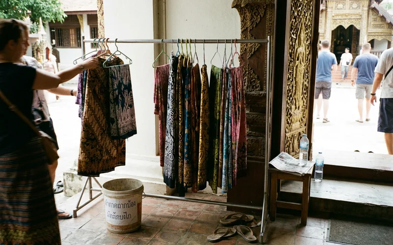 Sarong cover-ups hanging at a temple entrance for visitors