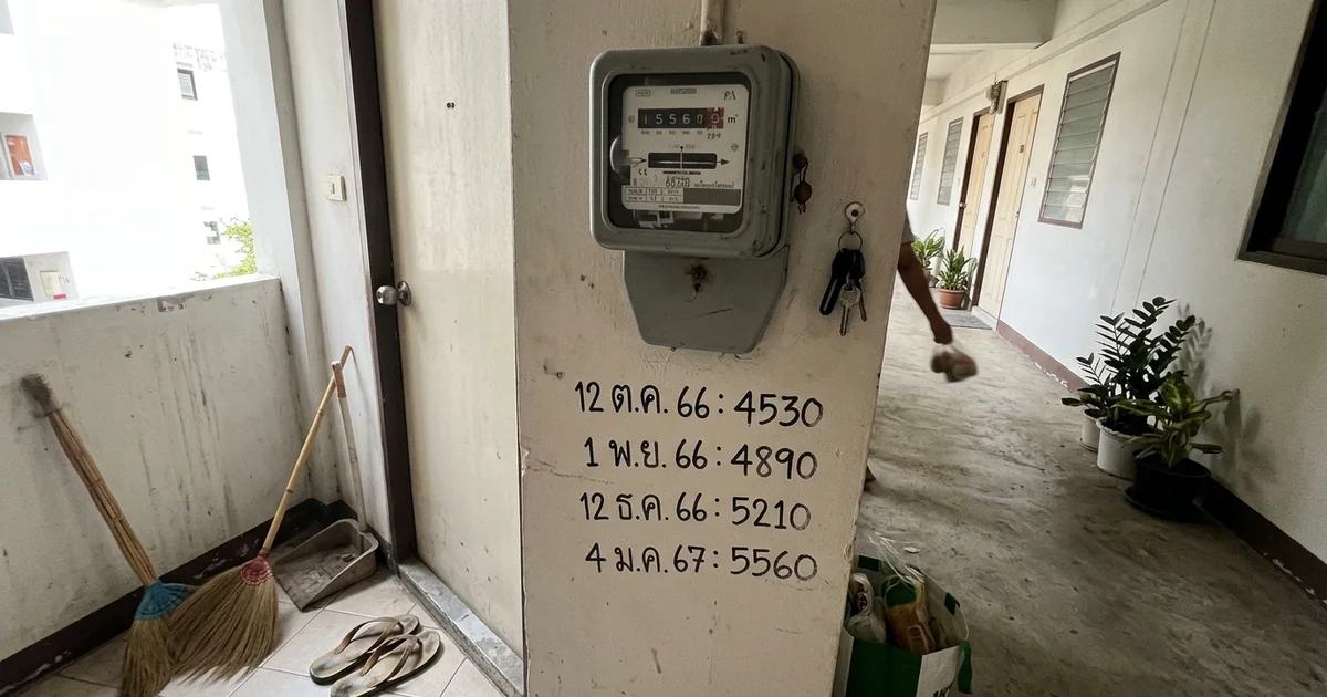 An electricity meter on the wall of a Chiang Mai apartment corridor